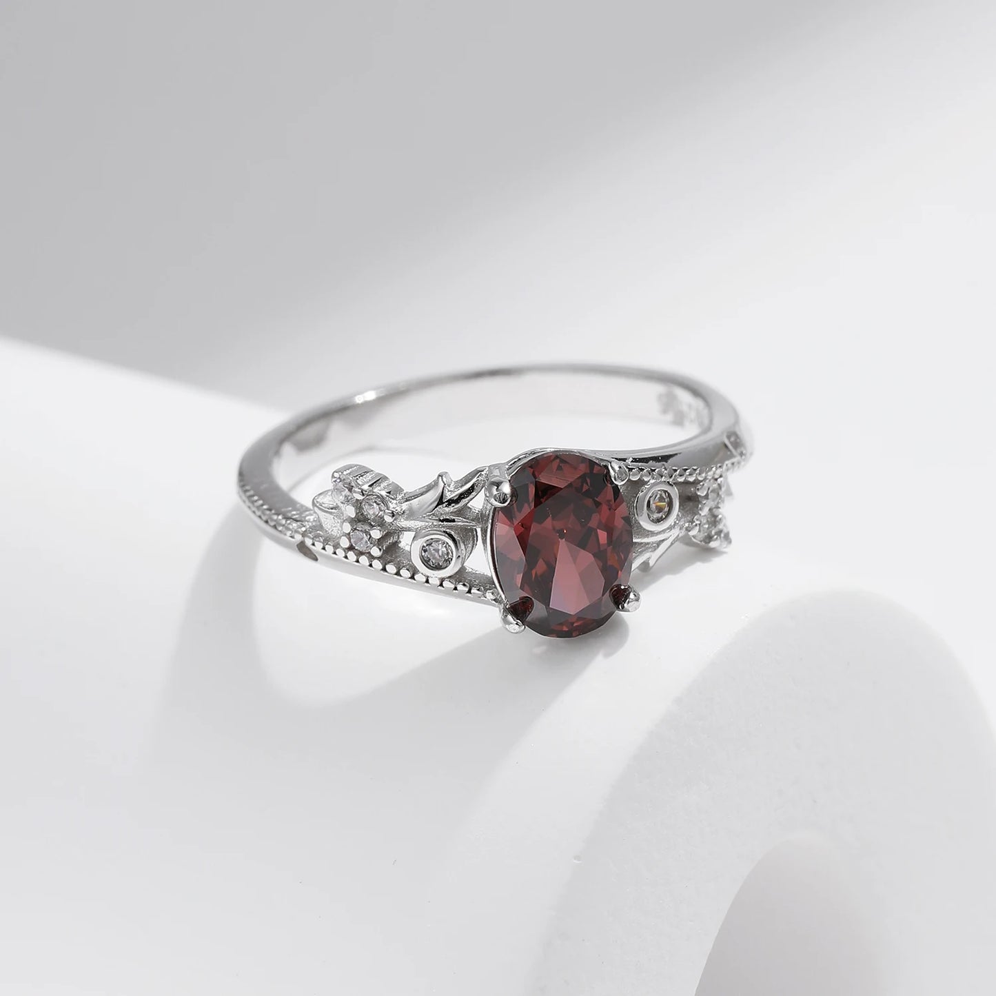 Sterling silver ring with a deep hazelnut-brown oval stone and decorative band