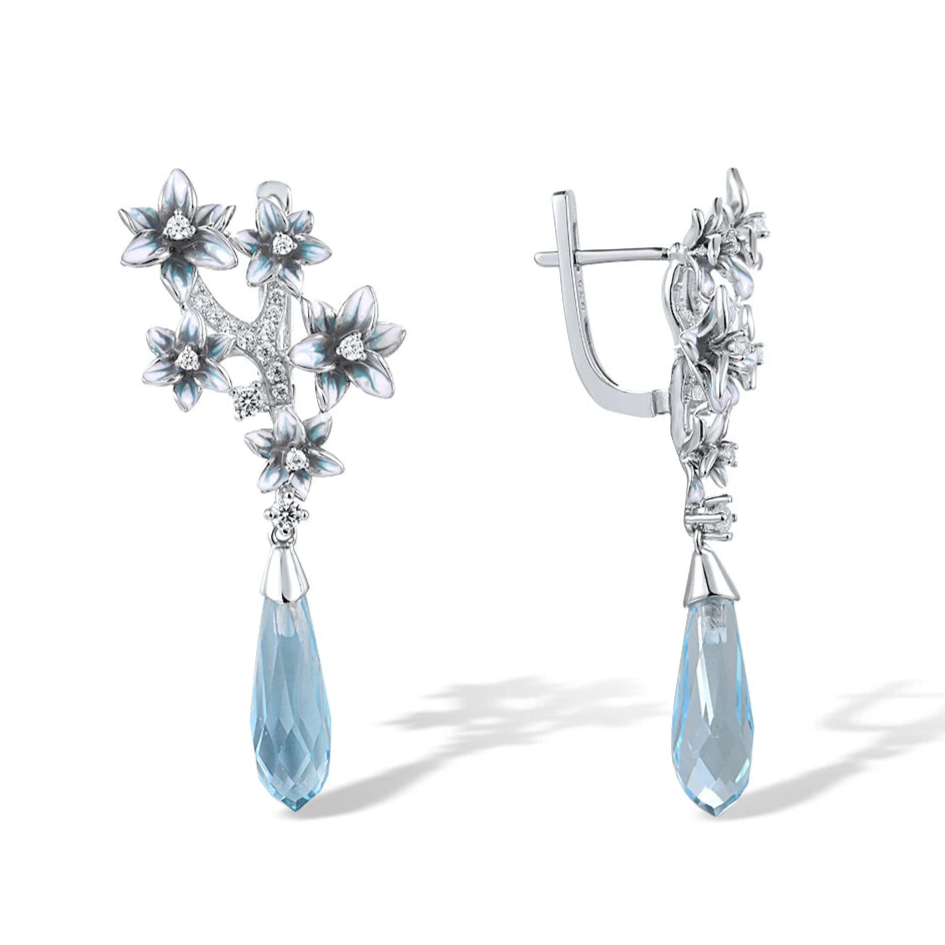 Sterling silver chandelier earrings with blue crystal teardrops and floral detailing from the Azzurro collection.