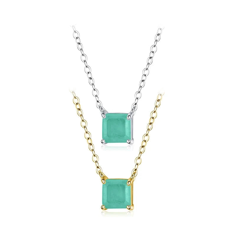 Square light green gemstone pendant on a fine gold chain.