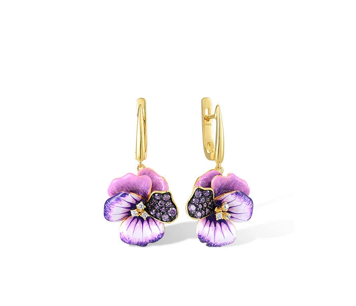Gold jewelry set with violet enamel pansy flowers and pavé purple stones, including earrings, pendant, and matching ring