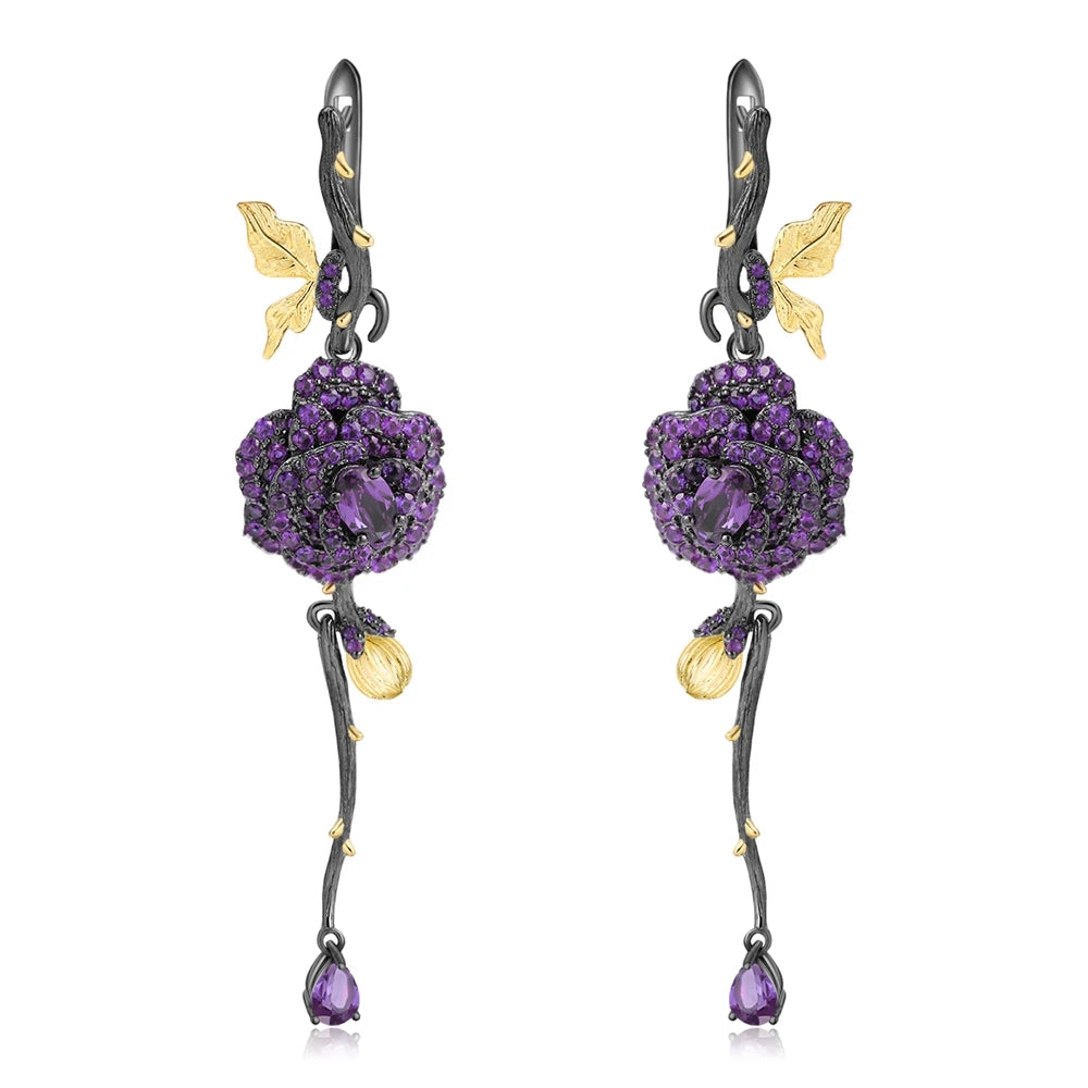 Long black rose earrings with red gemstones, gold leaves, and bud details from the Rossa Collection.
