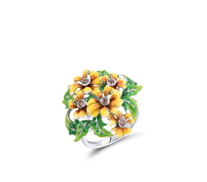 Jewelry set featuring yellow-orange flowers with green enamel leaves and teardrop green gemstone dangles