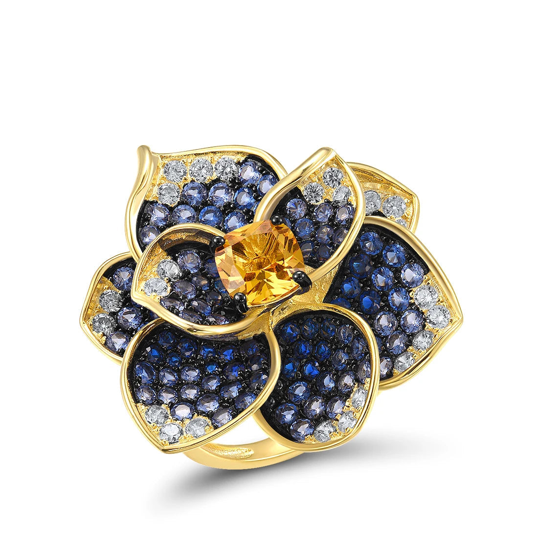 Statement floral ring in gold plating, with deep blue and clear pavé stones and a golden-yellow center gem