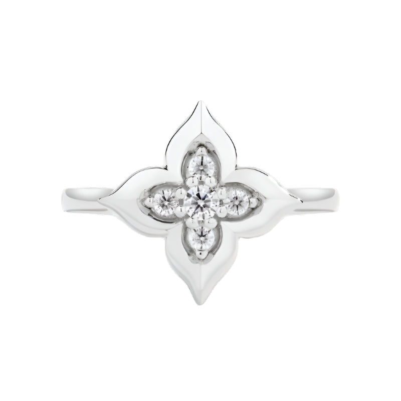 Moissanite floral ring in white gold and yellow gold plating, shown on hand and styled in various settings