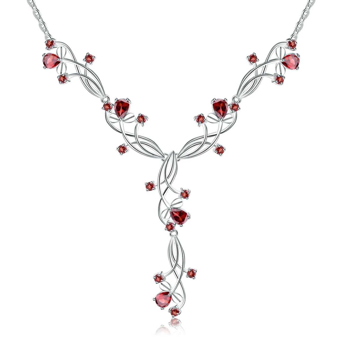 Silver necklace with a swirling vine-like structure, adorned with deep red gemstones arranged in floral and geometric clusters.