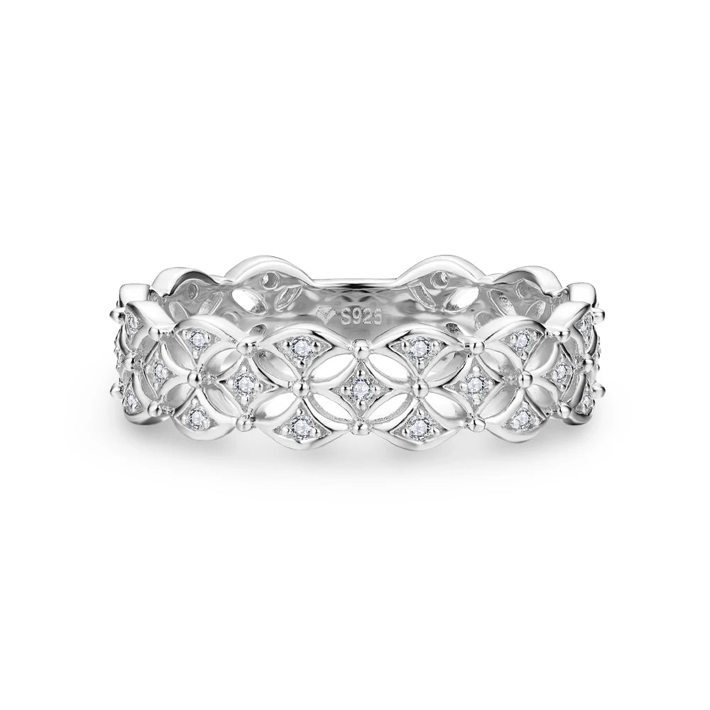 Gold-plated floral pattern ring featuring openwork petals set with small white stones throughout the band.