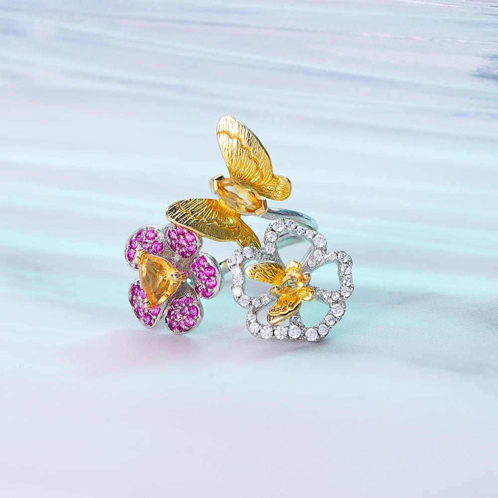 Open floral ring with red gemstone flowers and butterflies in silver and gold tones from the Rossa Collection.