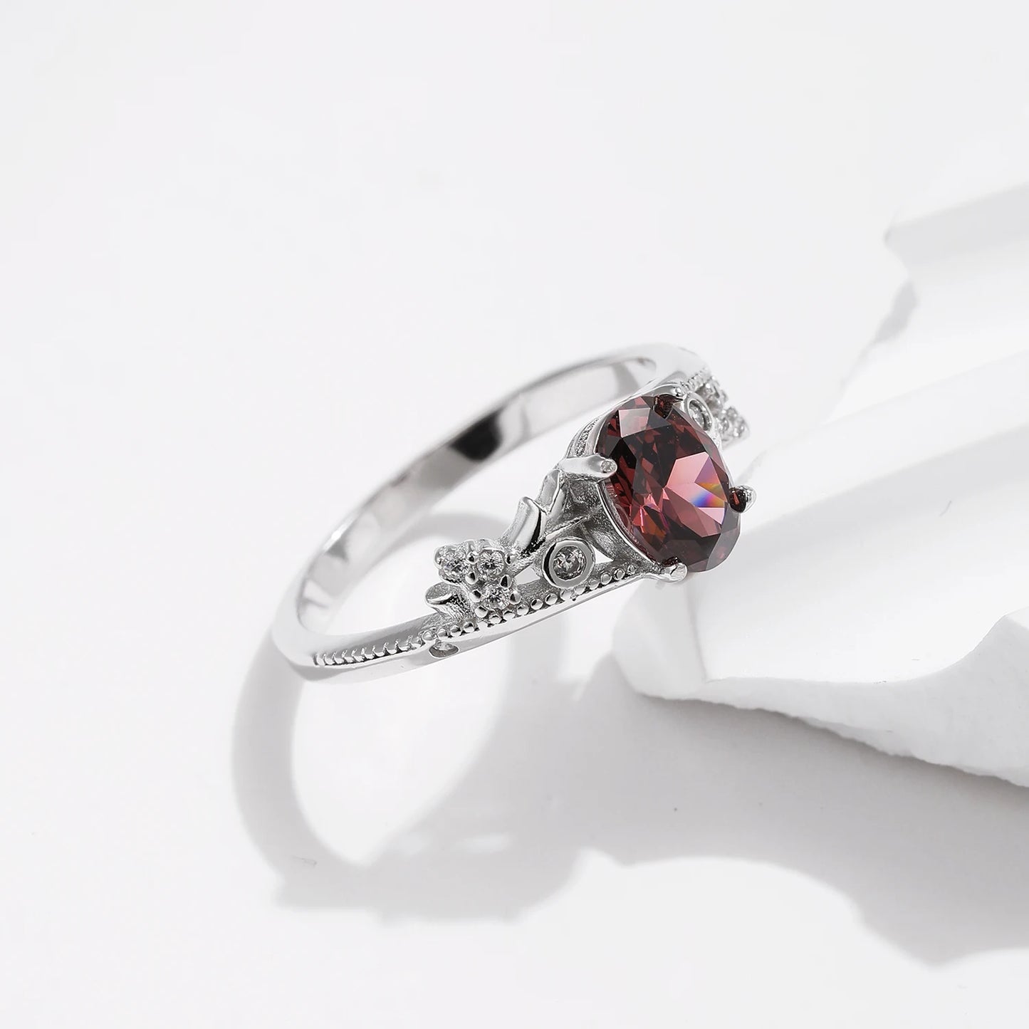 Sterling silver ring with a deep hazelnut-brown oval stone and decorative band
