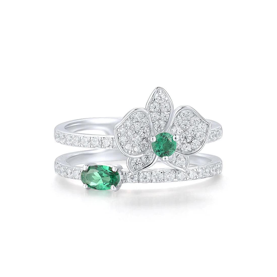 Silver ring featuring a sparkling orchid flower design with green and clear stones and a double-band setting
