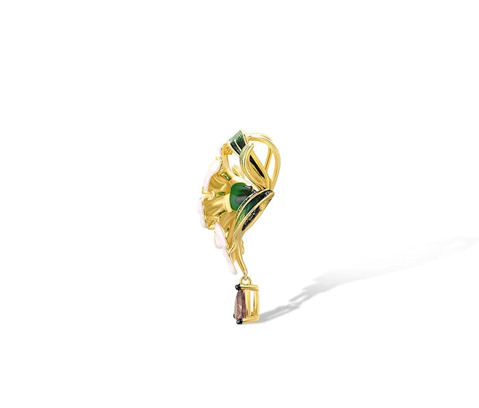 Gold floral jewelry set with white and green enamel petals, gold detailing, and brown teardrop stones