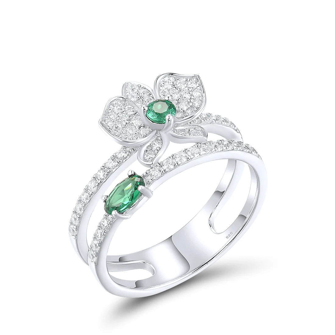 Silver ring featuring a sparkling orchid flower design with green and clear stones and a double-band setting