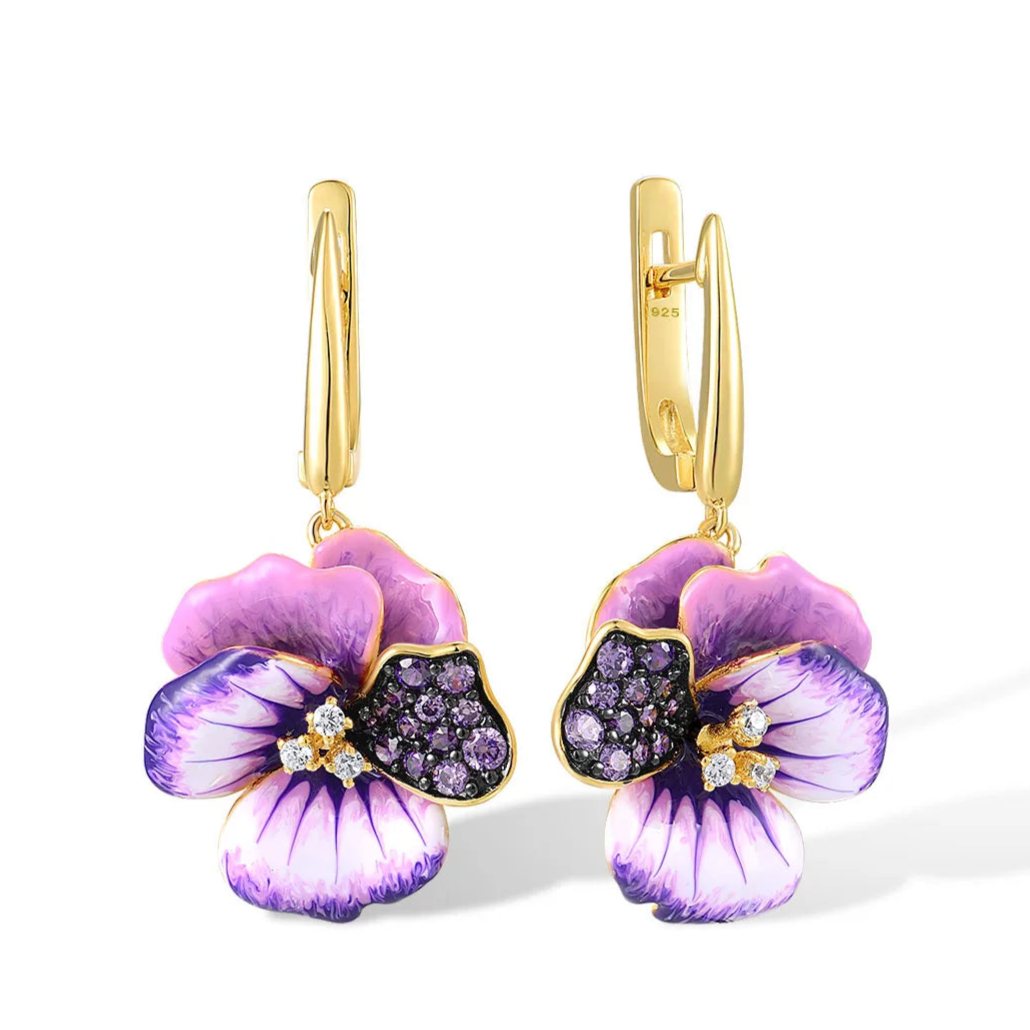 Gold-plated earrings with purple enamel pansy flowers and pavé gemstone detailing