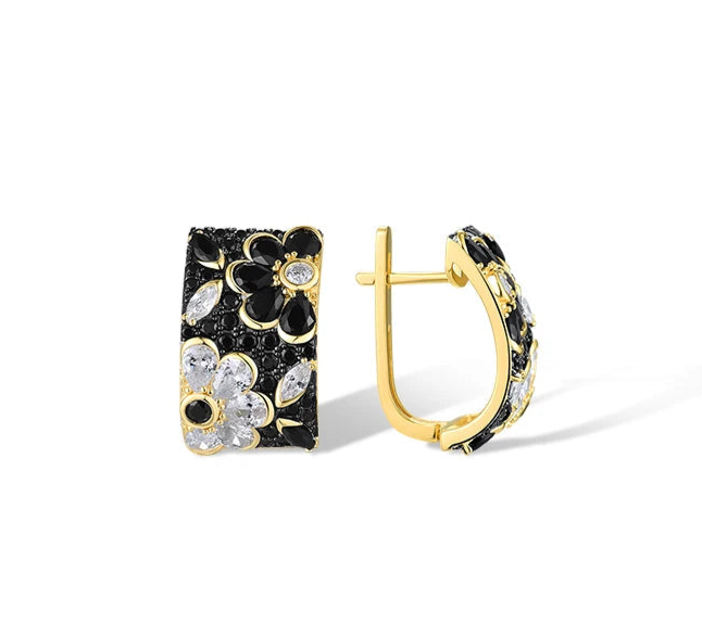Floral huggie earrings with black and white stones set in gold-tone detailing