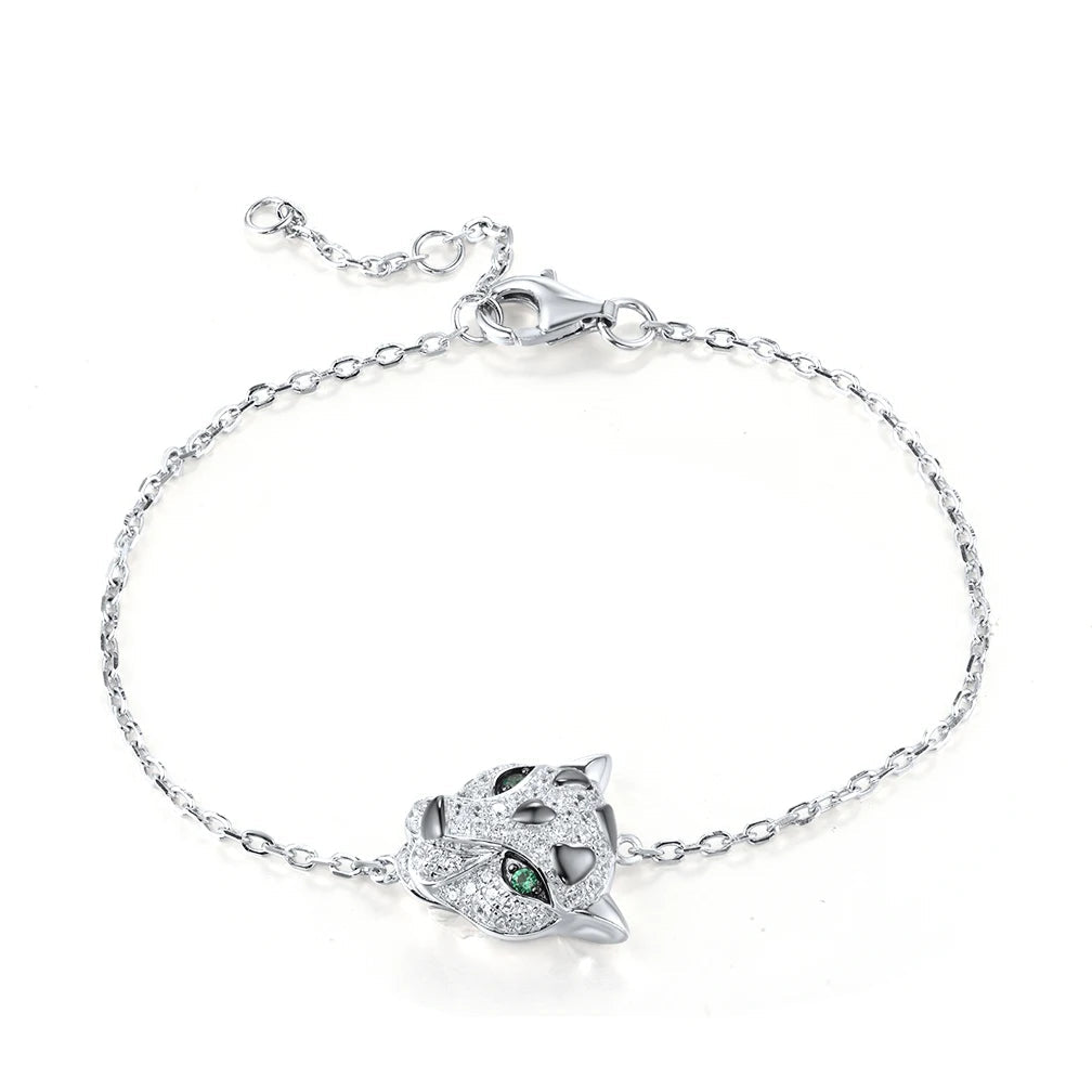 Panther head bracelet with green eyes and pavé details