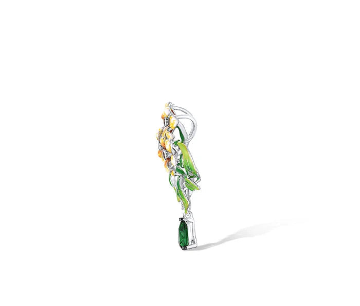 Jewelry set featuring yellow-orange flowers with green enamel leaves and teardrop green gemstone dangles