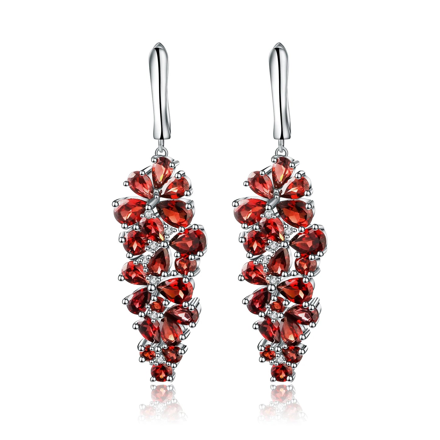 Dangling silver earrings adorned with clusters of deep red gemstones in grape-like floral formations.