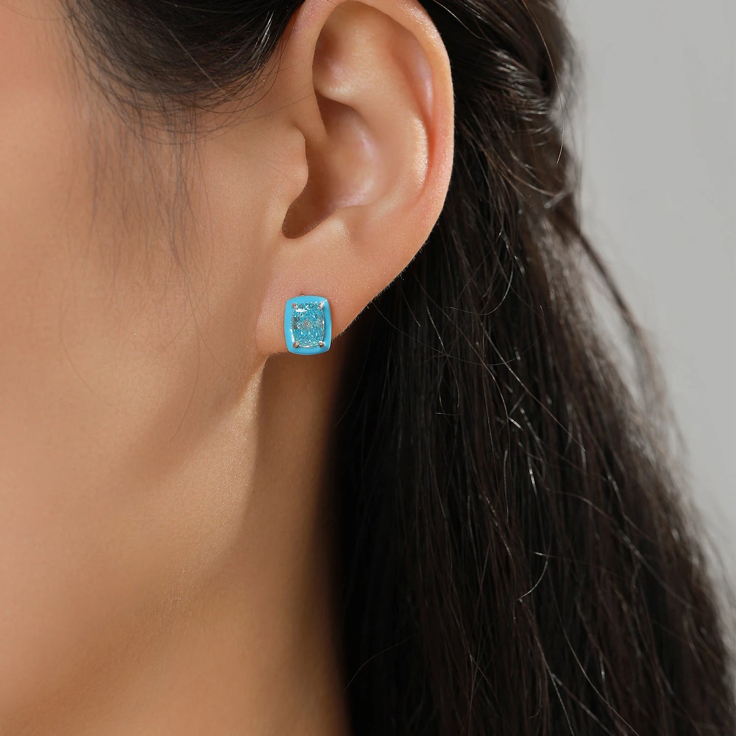 Set of three sterling silver stud earrings with deep blue, aqua, and lavender stones framed in coloured enamel