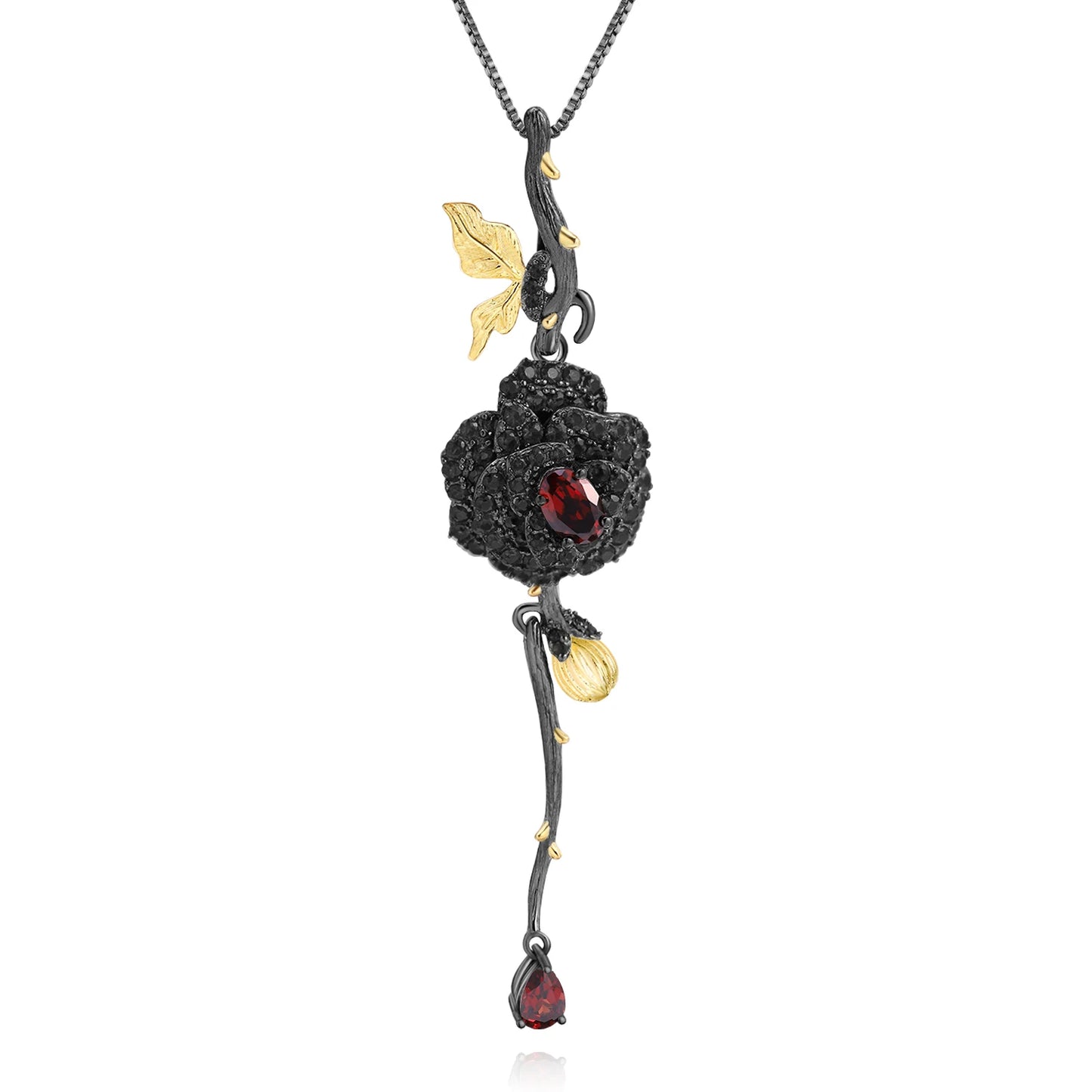 Pendant necklace with a dark rose-shaped bloom in ruby stones, accented by golden leaves and a delicate drop, from the Rossa Collection.