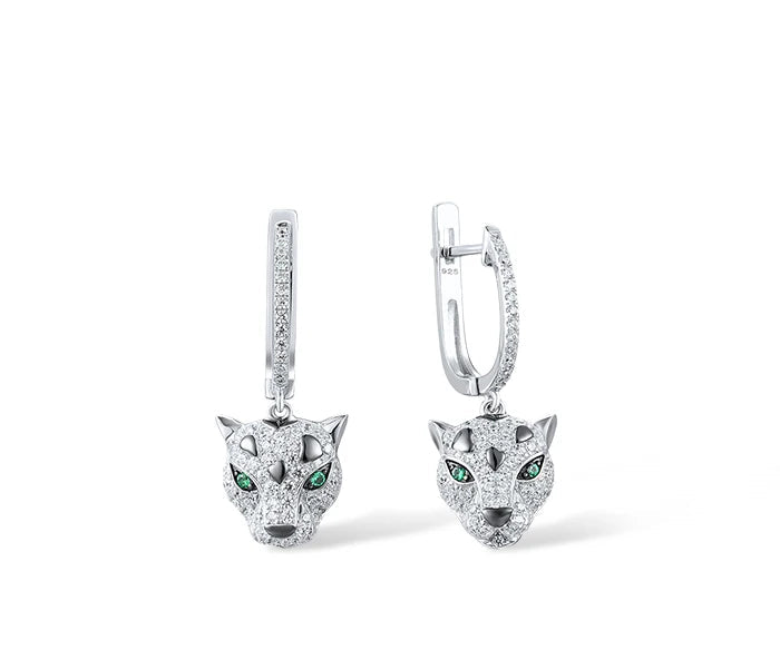 Jewelry set featuring panther head designs with pavé detailing and green gemstone eyes