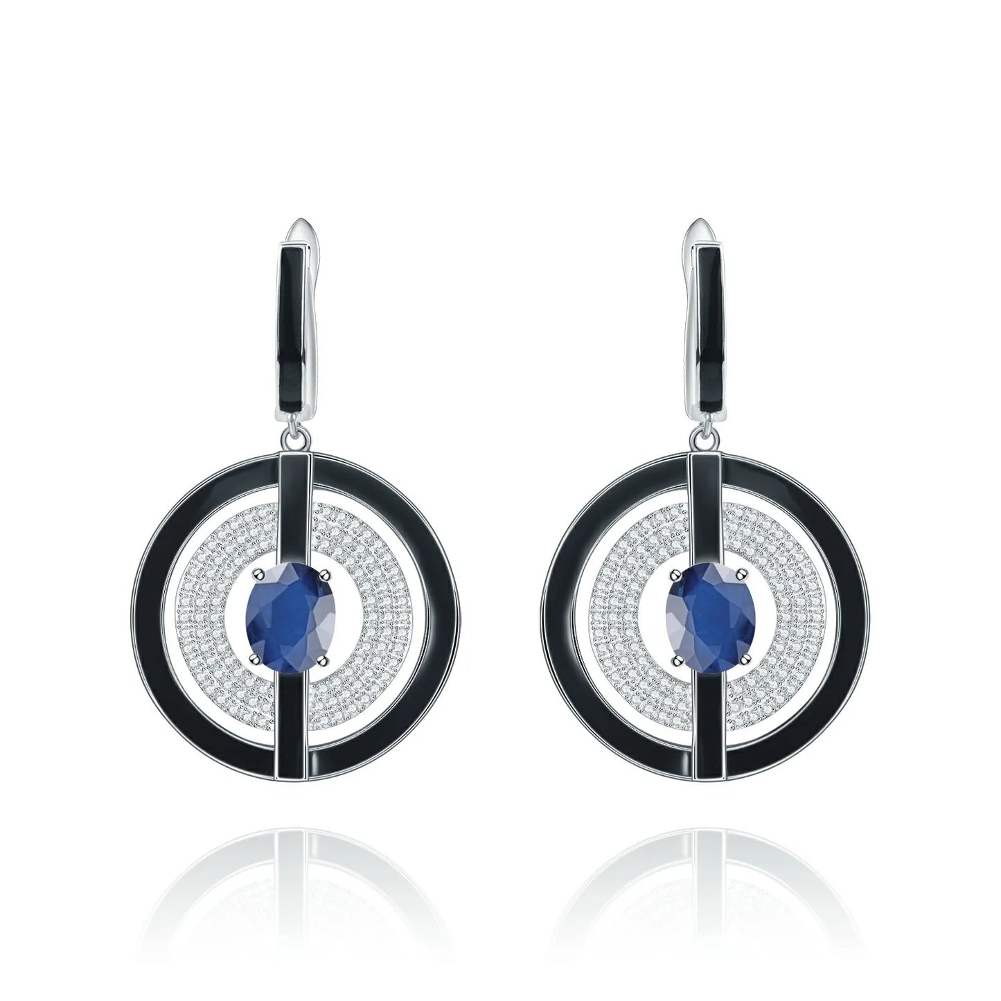 Sterling silver drop earrings with black enamel circular frames, pavé-set crystal detailing, and deep blue oval gemstones at the center