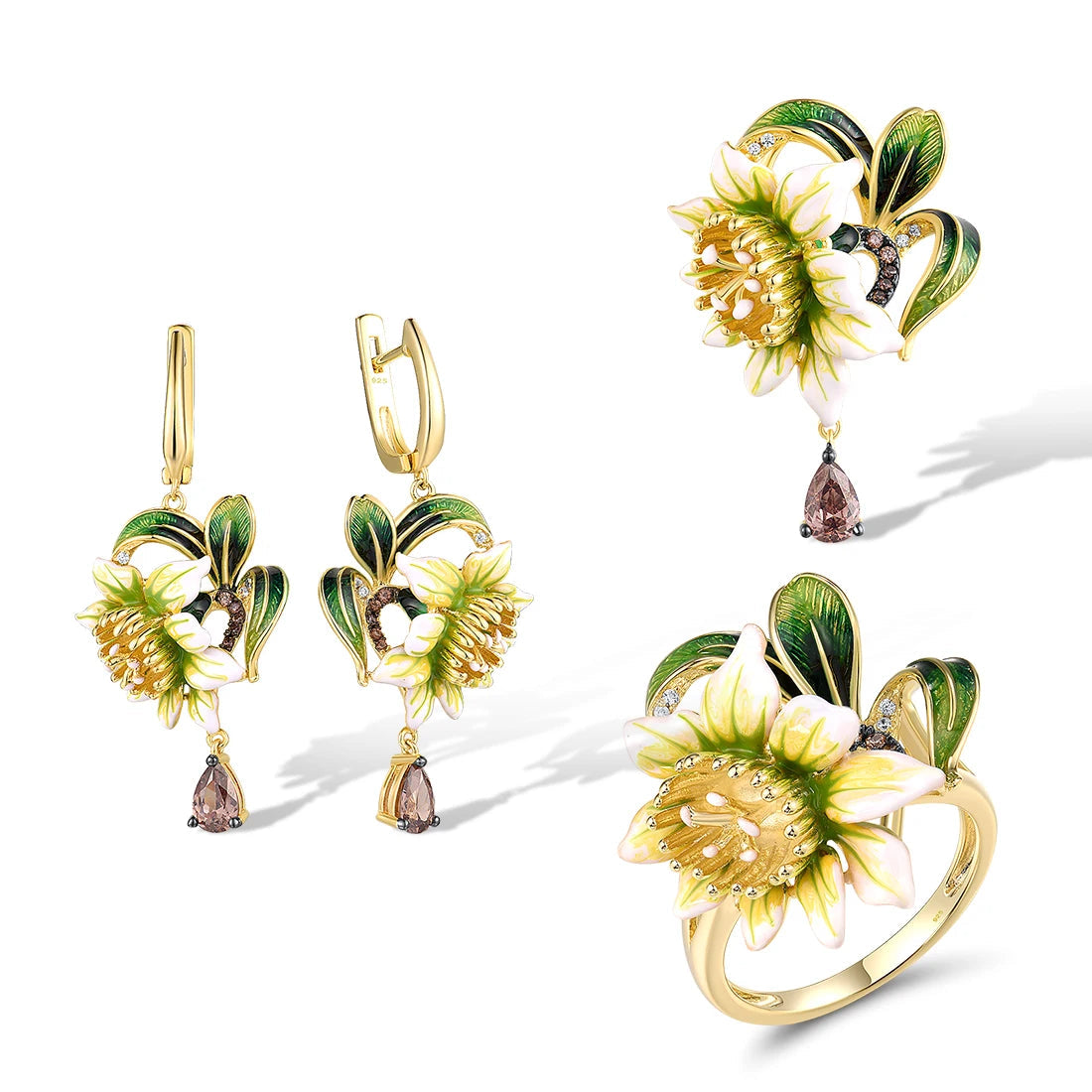 Gold floral jewelry set with white and green enamel petals, gold detailing, and brown teardrop stones