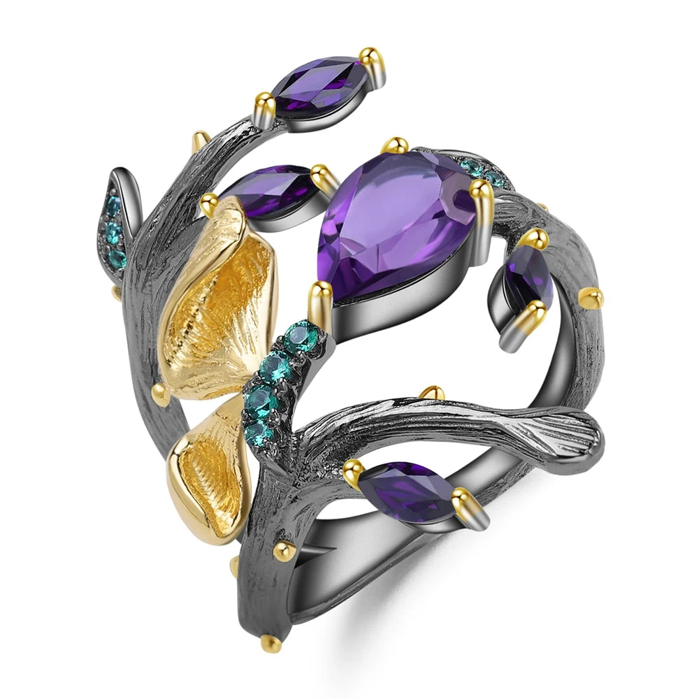 Black branch-style ring with purple stones, gold accents, and turquoise details