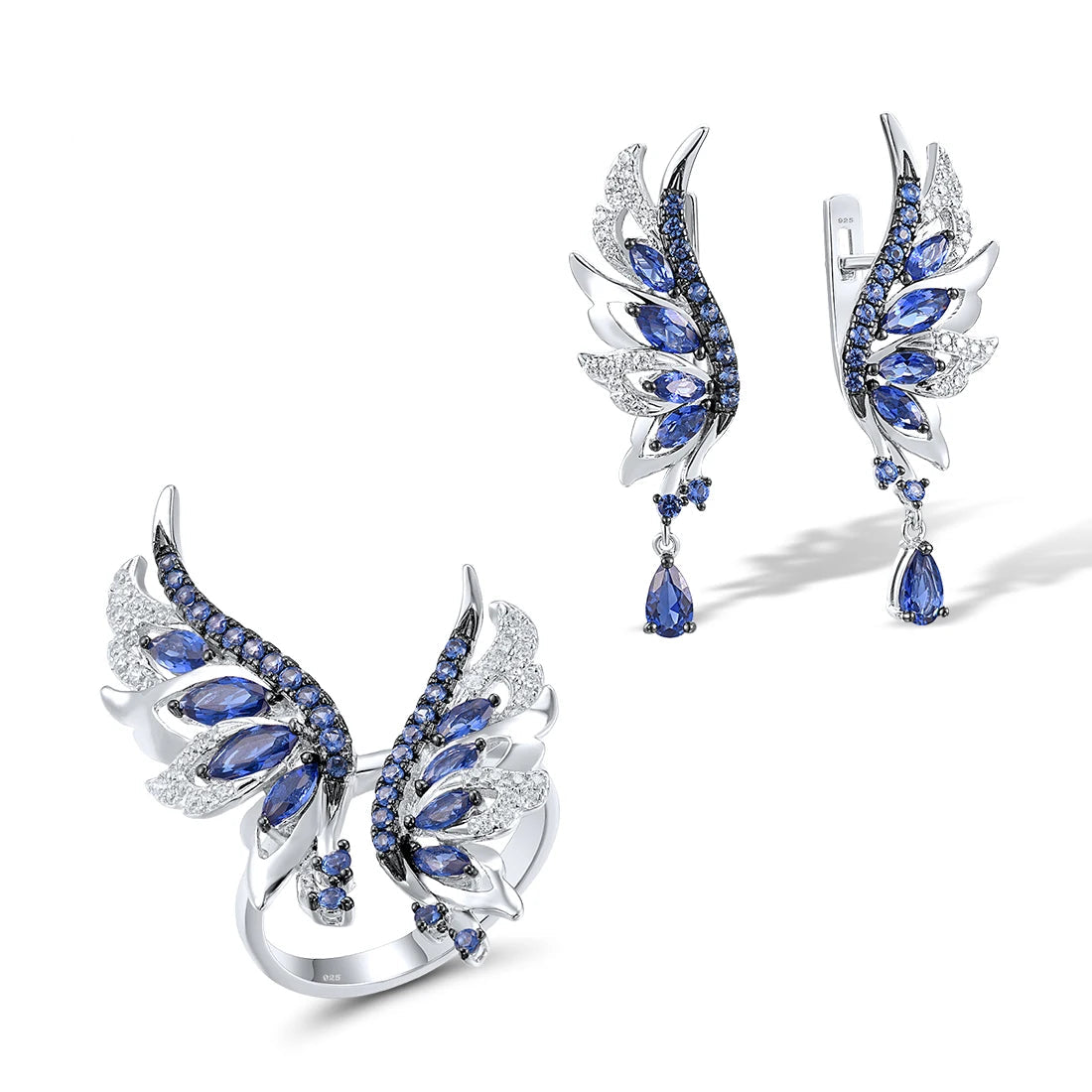 Matching silver ring and earrings set shaped like angel wings with blue and white stones in layered design