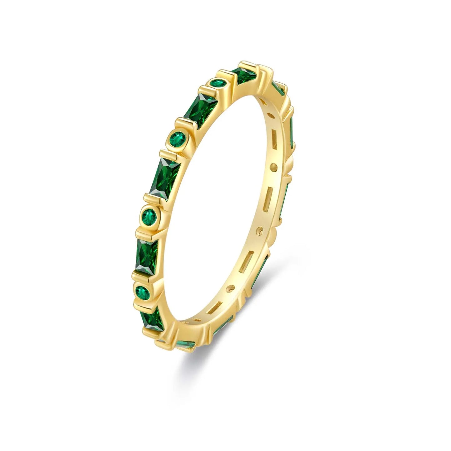 Gold eternity band with alternating round and baguette green stones