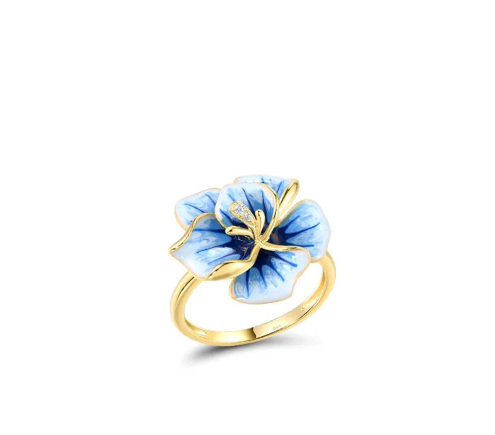 Jewelry set with hand-painted blue flower designs in gold-tone metal, featuring crystal accents