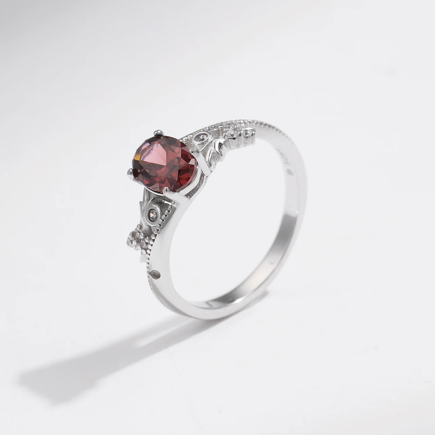 Sterling silver ring with a deep hazelnut-brown oval stone and decorative band
