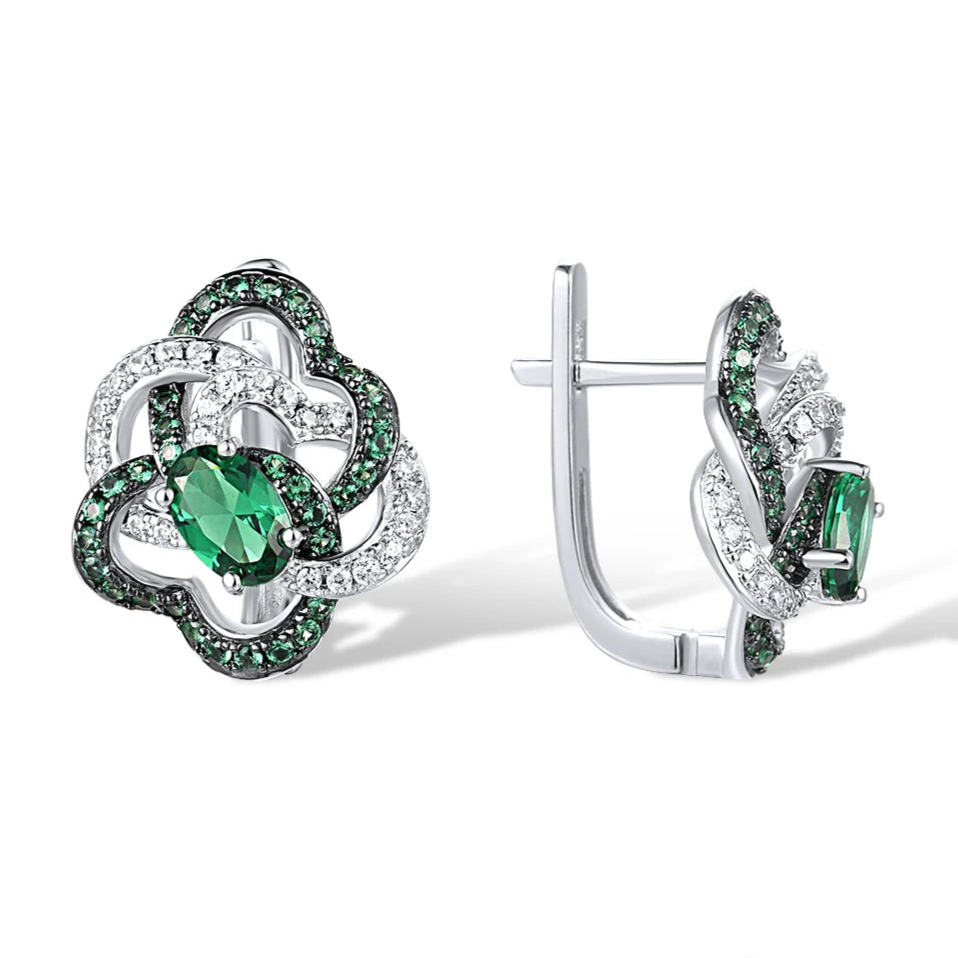 Silver earrings with interlocking openwork loops, pavé-set in white and green stones and centered with a marquise green gem
