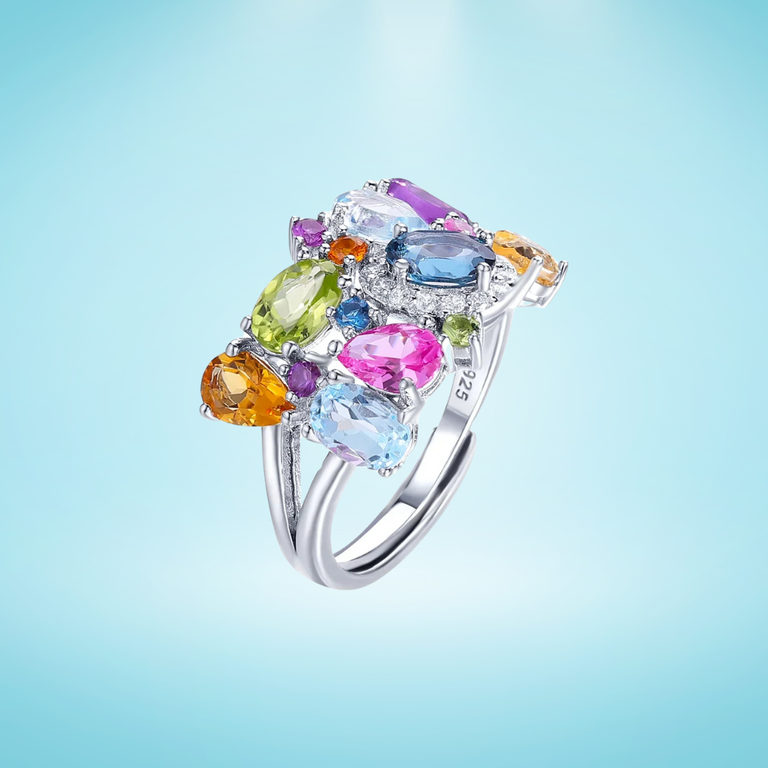 Silver ring with a cluster of multicoloured gemstones in various cuts