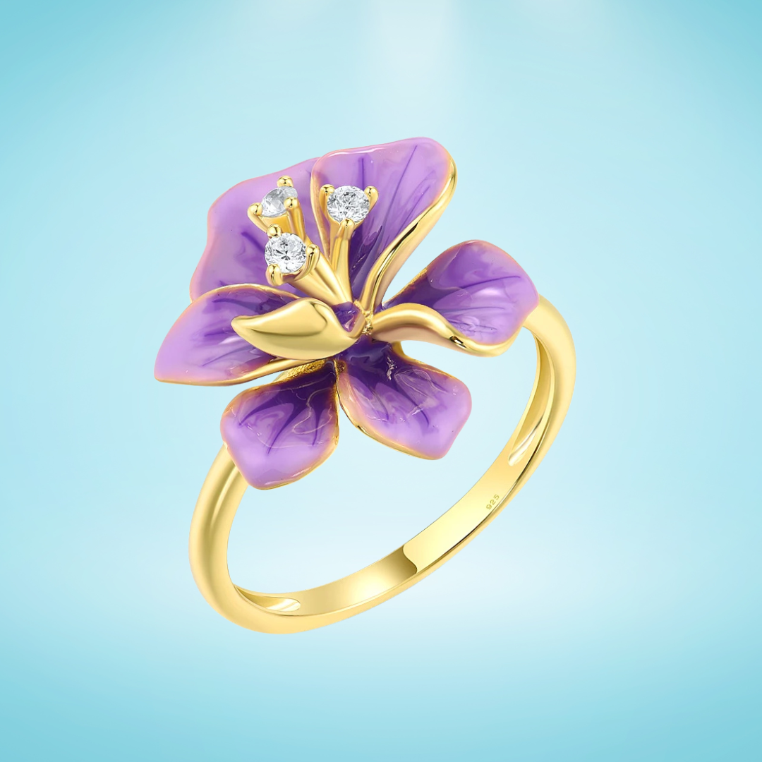 Gold ring with purple enamel flower and sparkling white stones