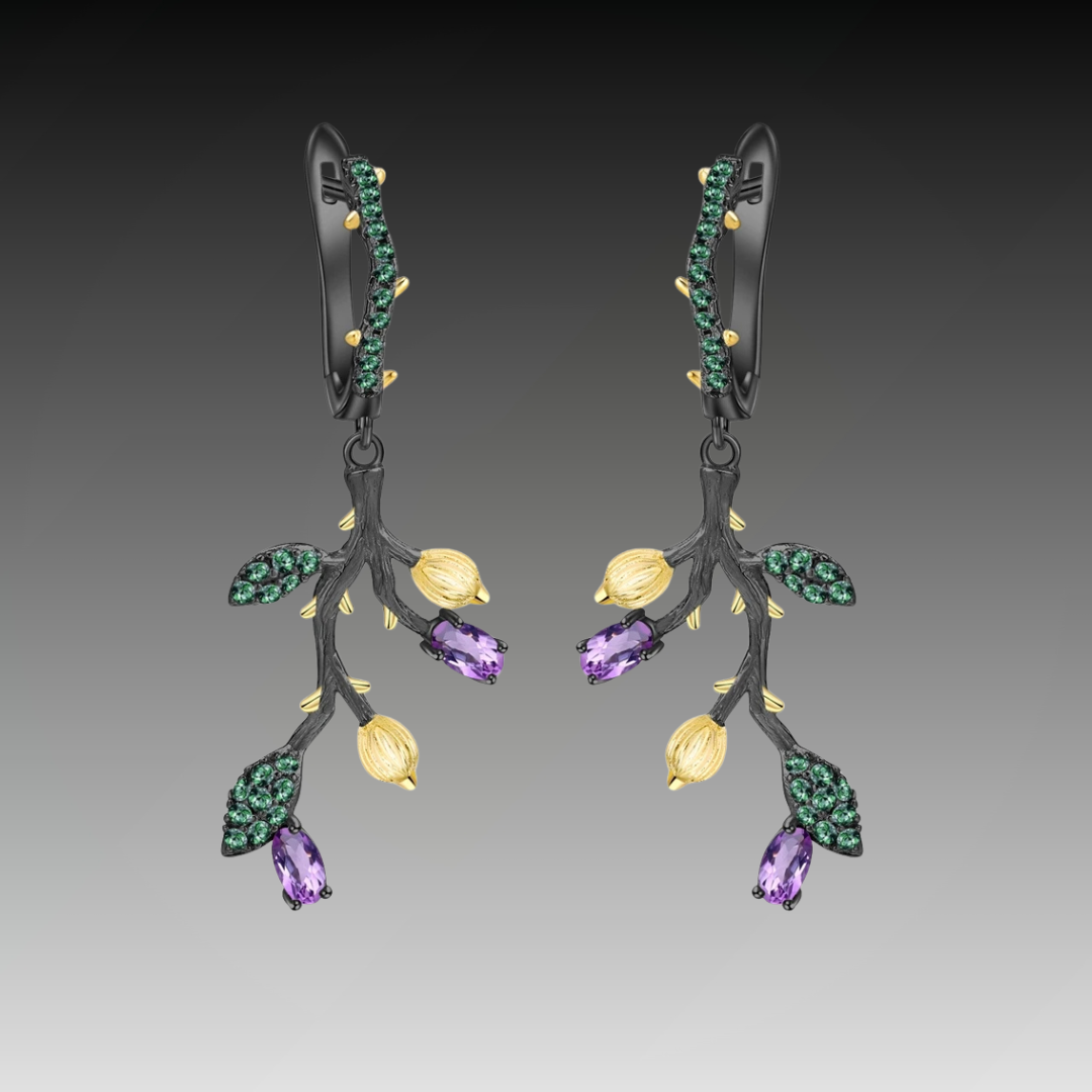 Botanical-inspired earrings with purple, green, and gold accents