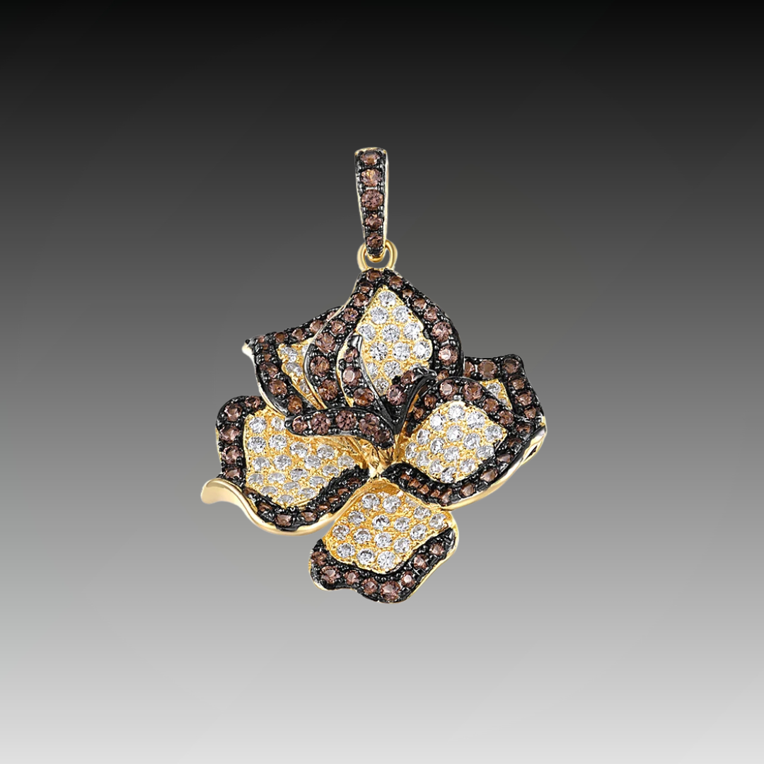 Pendant shaped like a layered flower with brown and white pavé stones on gold-toned metal
