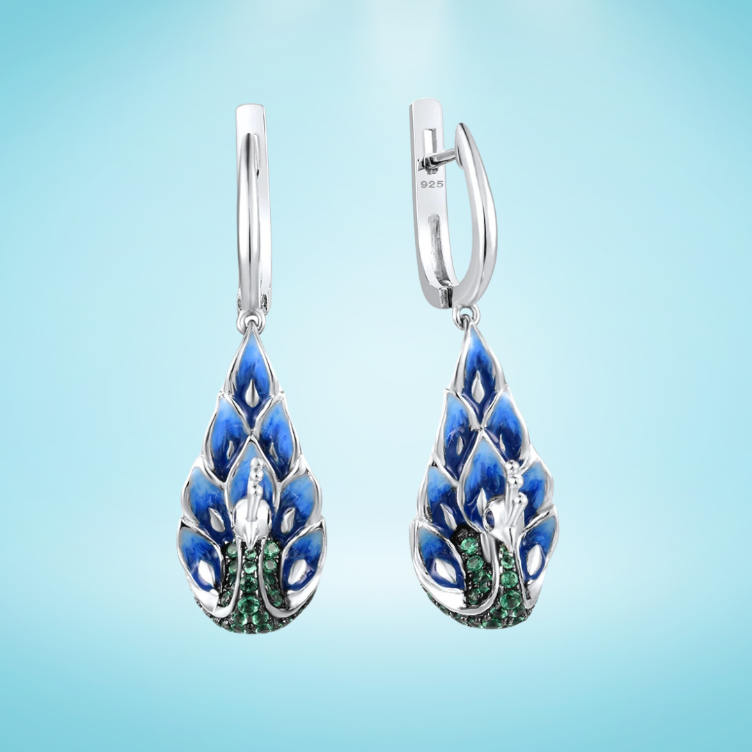 Sterling silver peacock drop earrings with blue enamel feathers and green pavé stones