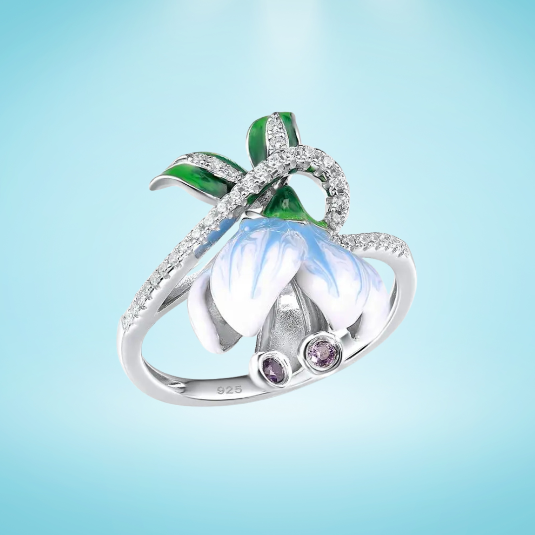 Campanula ring with hand-painted white and blue enamel flower, green leaves, and pavé detailing – Azzurro Collection