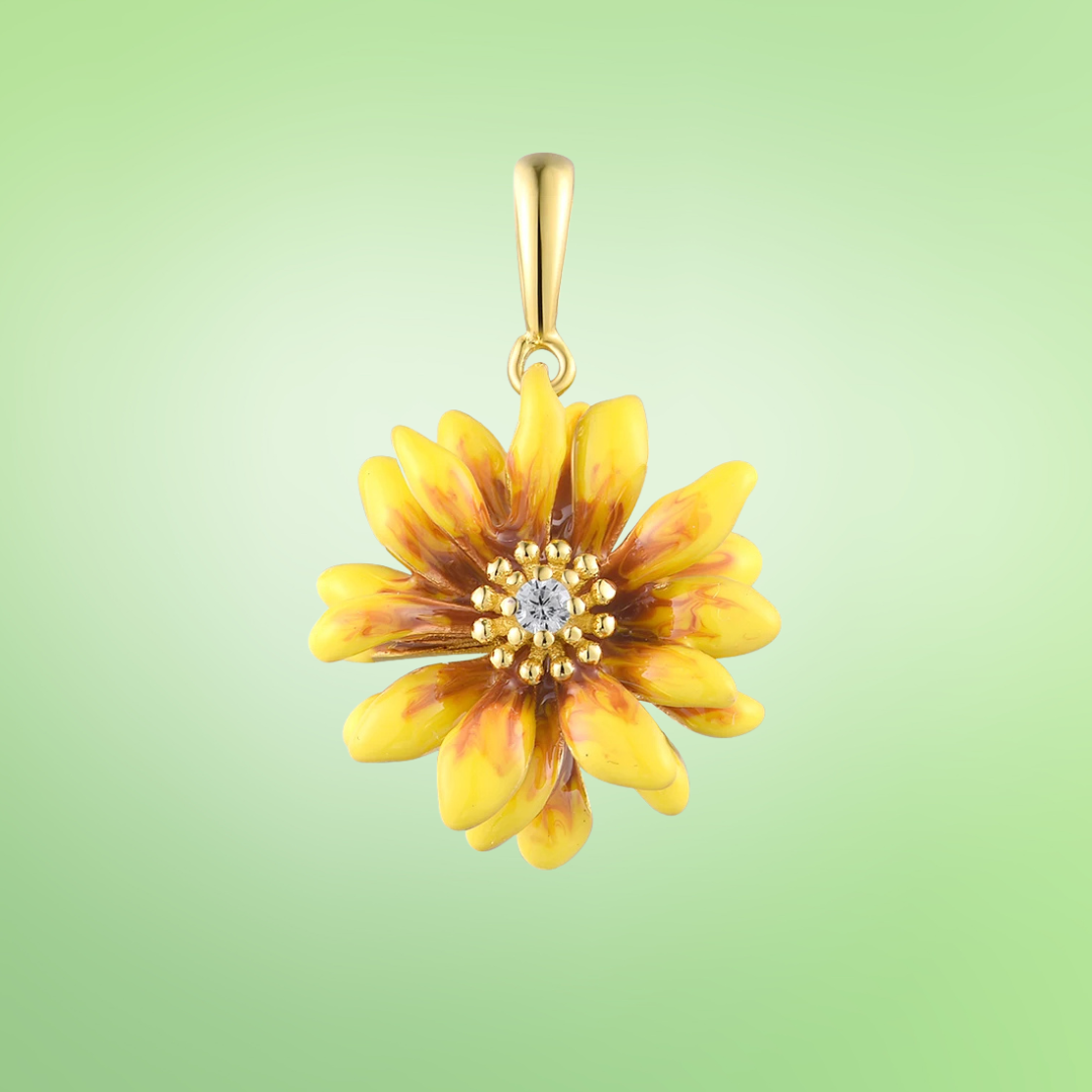 Yellow and brown enamel flower pendant with central crystal accent
