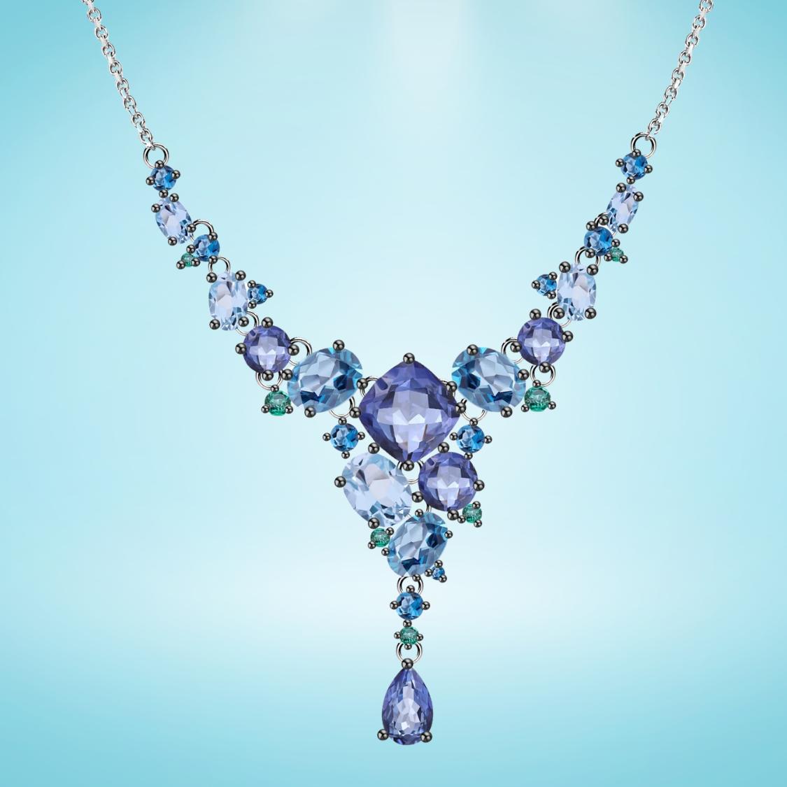 Necklace with gradient blue and green gemstones arranged in an organic cascading pattern