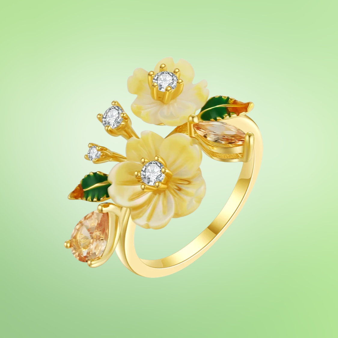 Yellow flower ring with gemstone accents and green enamel leaves on gold band