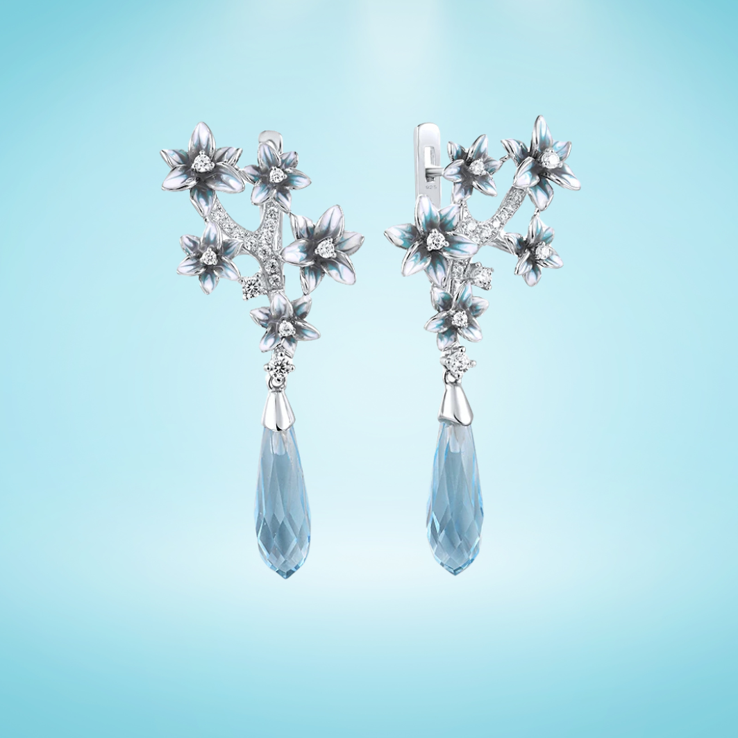 Sterling silver chandelier earrings with blue crystal teardrops and floral detailing from the Azzurro collection.