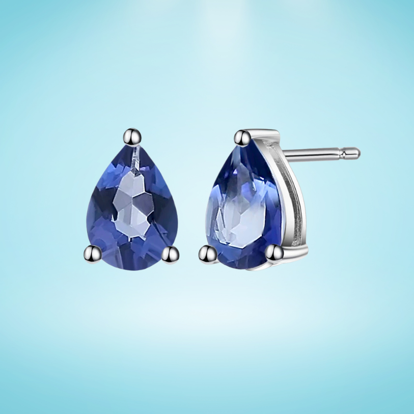Silver stud earrings with deep blue teardrop-shaped quartz stones

