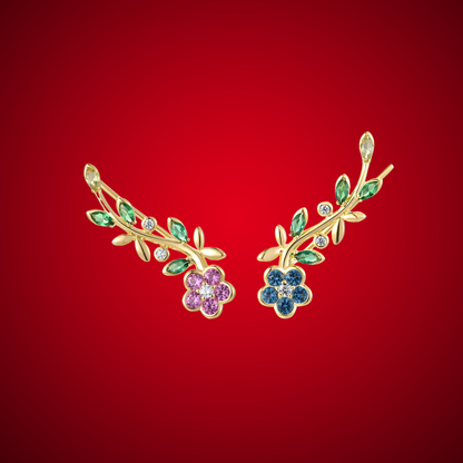 Gold floral earrings featuring multicoloured gemstones in a vine-inspired arrangement.

