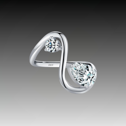 Sterling silver bypass ring featuring two white round-cut stones in a modern flowing design

