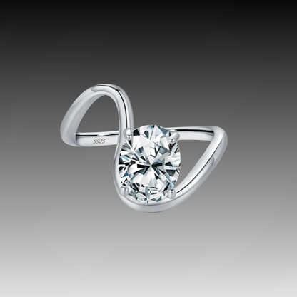 Open silver ring with a triangular wrap design, featuring a prominent oval white stone at its center, from the Bianco Nero collection.

