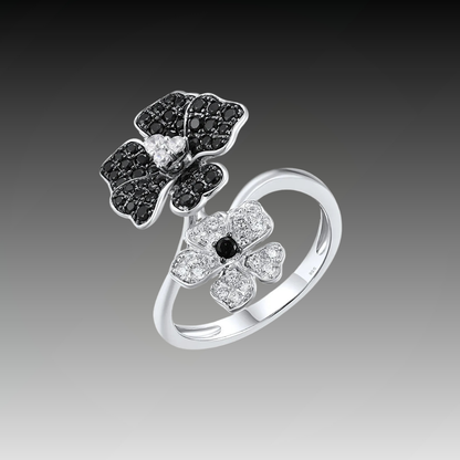 Sterling silver open ring with black and white crystal-studded flowers, part of the Rosa Nera collection.

