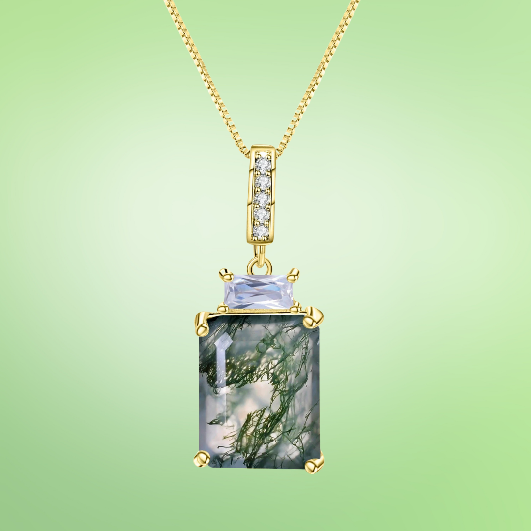 Gold necklace with rectangular moss agate pendant and small lavender gemstone accent

