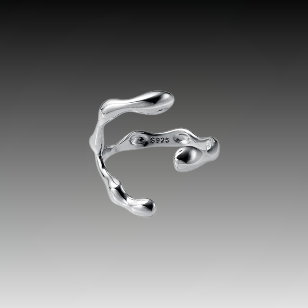 Sterling silver ring featuring a baroque freshwater pearl encased in an abstract organic claw setting

