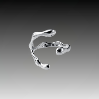 Sterling silver ring featuring a baroque freshwater pearl encased in an abstract organic claw setting

