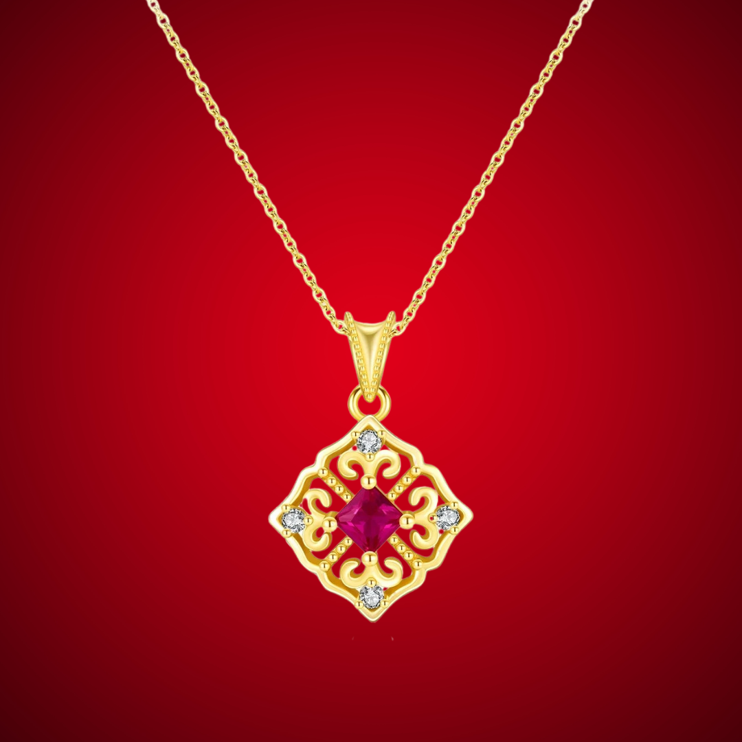 Gold-plated necklace with a ruby-red square stone and ornate vintage design

